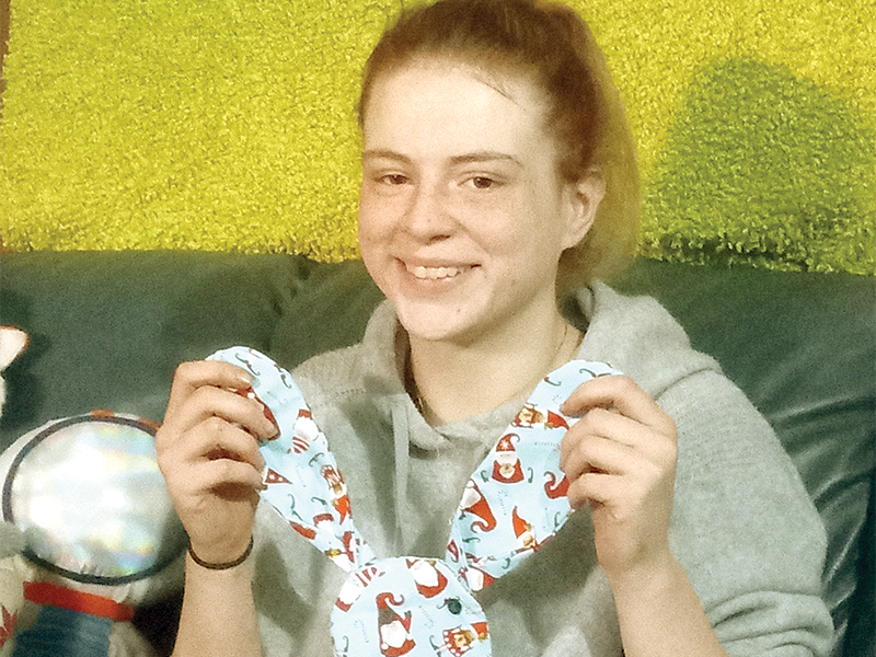 Cristin “Scarlet” Combs works on sewing a hand-stitched stuffed animal for a friend who’s expecting a baby. A former foster child whose name was changed after adoption, Combs has been trying for several years, but is still unable to obtain a copy of her birth certificate and a Social Security card. 