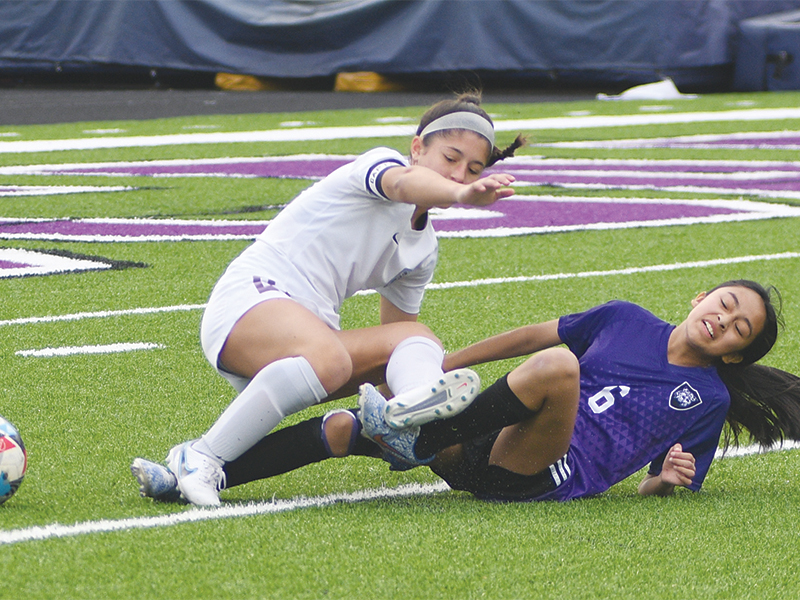 Gilmer Lady Cat defender Selma Gonzalez (6) thwarts a Lumpkin County attack with a slide tackle last Tuesday. She scored a goal following a corner kick in the second half. 
