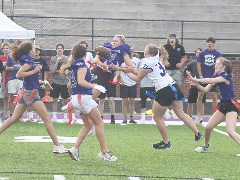 Senior Macy Hamby (24) breaks up a pass intended for Lucy Ray (33). Hamby completed a touchdown pass to Brooke Wilson and ran for another as the seniors won, 12-0.