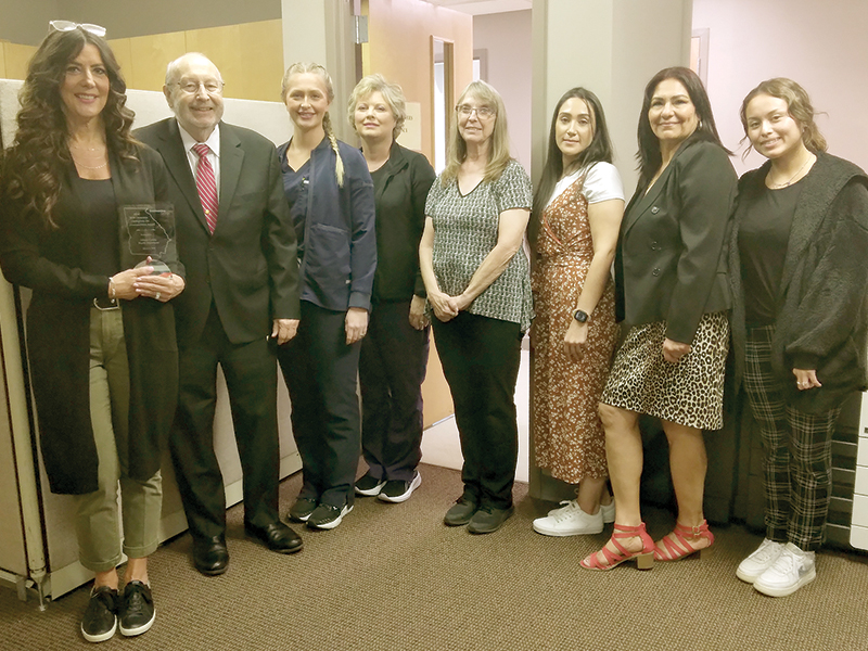 Gilmer County Health Department staff members and Board of Health chairman Charlie Paris are shown with the Walt Orenstein Champions for Immunization Award, which the local health department received for its 2023 vaccination efforts in the community. Pictured, from left: nurse manager Krystal Sumner, board chairman Charlie Paris, Racquel Watkins, Leigh Ann Dover, Trina Matthews, Llanet Ortiz, Irene Rosales and Josi Aguillion.