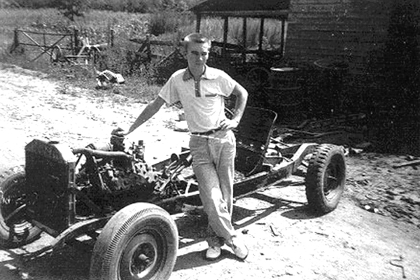 Playing music and working on cars were two favorite pastimes of Larry Davis, pictured, above, as a young man with work to do.