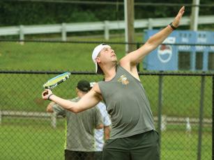 Zach Henderson is shown competing in last year’s inaugural Justin Elliott Memorial Tennis Tournament. 