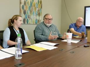 From left, Environmental Health Manager Andrea Mathis, Environmental Health Director Ray King and North Georgia Health District Director Dr. Zachary Taylor discuss a new policy that addresses multiproperty sewage disposal systems during the Gilmer Board of Health’s recent quarterly meeting. 