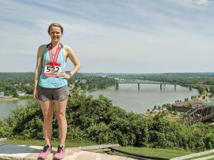 Allison Fuller is pictured near the Ohio River after completing half marathon #24 in Parkersburg, W. Va. 
