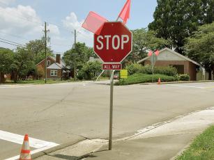 Flags have been attached to new stop signs on North Main Street to draw drivers’ attention to the new four-way stop. 