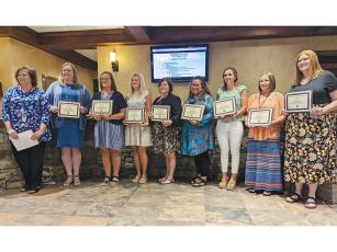 Joining district finance director Trina Penland from left are newly-certified staff members Sabrina Teague, Regina Hill, Penny Griggs, Page Reynolds, Maria Nieves, Brittany Lomonaco, Amber Kerr and Amy Rogers. Not pictured, Mandy Sanford.