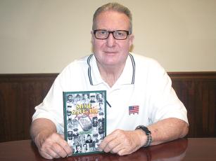 Mark Millican is shown with a copy of his new book Some Gave All, which profiles the young men from Gilmer, Murray and Whitfield County who died serving in the Vietnam War. 