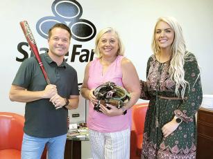 Gilmer Sports Collective team members Kim Sproull, center, and Catherine Weis, right, are pictured with State Farm agent Chris Wang, one of four local businesses collecting gently used sporting equipment that will be used by players on rec department teams. 