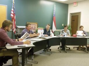 Ellijay Downtown Development Authority members listen to a presentation on possible cleanup areas and better downtown walkability from DDA member Keith Nunn. Pictured, from left, Josh Moyers, Nunn, Reece Sanford, Ellen Grant and Sarah Burnette. 
