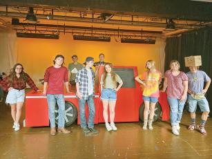 Members of the cast of “Hands on a Hardbody” rehearse for the upcoming one-act play at Gilmer High School. Pictured, from left: Amber Collins, Lucas McCoy, AJ Parker, Caiden McCoy, Tracy Mosley, Abbie Flowers, Chelsea Parker, Addie Davenport and Nick Dombrowski.
