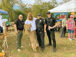Bigfoot gets some safety tips from the Ellijay Police Department's Capt. Ray Grace and officers Brian Stafford and Caleb Hensley. 