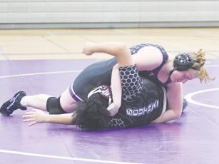 Gilmer’s Taylor Scheisser is moments away from pinning her Southeast Whitfield opponent last Thursday.