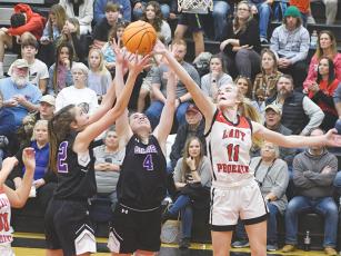From left, Gilmer’s Madison Bradshaw and Aliza Chastain go up for a rebound. Versus Murphy, N.C., last Saturday, Bradshaw collected 14 rebounds and scored eight points. Chastain totaled 11 points, four assists and two blocks.