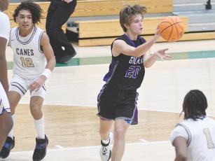 Gilmer freshman Keegen Bryant passes to an open teammate versus Cartersville last Thursday. He finished the game with 15 points, seven rebounds and six assists.