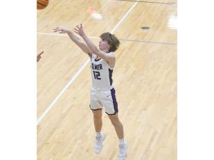 Gilmer High senior Christian Sumner shoots a three pointer and scored seven straight points in the fourth quarter last Saturday to help the Bobcats defeat West Hall.