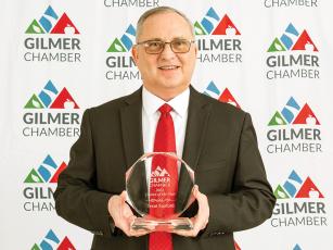Gilmer Chamber Citizen of the Year Trent Sanford is shown with the 2023 COTY award after receiving it at the chamber’s recent gala and awards reception. 