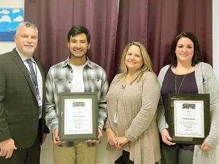 Esteban Cecilio, second from left, and Dr. Melissa Galloway, right, are announced as Gilmer High School’s 2023 STAR Student and Teacher. Also pictured are GHS principal Derek Bowen and counselor Gina Eaton-Nichols.