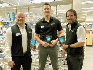Huff’s Drug Store pharmacists Danny Postell, Justin Hildreth and Steve Purvis are shown with some of the Deterra pouches the local pharmacy is offering. Funded by an opioid abuse reduction grant from Mercer University, the pouches can be used to safely de-activate and dispose of certain prescription medications.