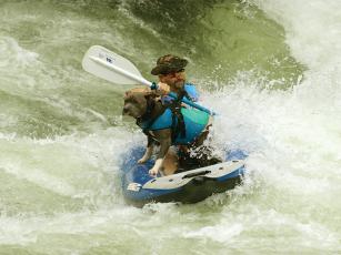 Aaron Dean and Knucklehead tackle the class 3 rapids of the Nantahala River by kayak. 