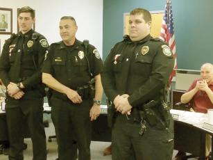 Ellijay police officers Kaleb Hensley, left, and Brian Stafford, right, received lifesaving awards from Chief Edward Lacey, center, at a recent Ellijay City Council meeting. Mayor Al Hoyle is pictured in background. 