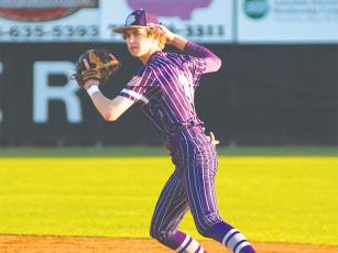 Gilmer High School second baseman Haden West makes a throw to first for an out.