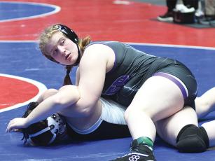 Gilmer High junior Taylor Schiesser pinned the No. 1 ranked wrestlers in her weight class at the Viper Pit Nationals Open to win the folkstyle championship.