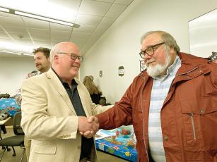 Ray King, retiring environmental health director for the North Georgia Health District (NGHD), right, is congratulated by NGHD Health Director Dr. Zachary Taylor during a retirement ceremony for King held last week in Canton. King worked with the Georgia Department of Public Health a total of 40 years. After working in the Columbus Health District, he started with the North Georgia district in 2003 as Gilmer’s environmental health manager. Since 2005, he’s served as environmental health director for the six