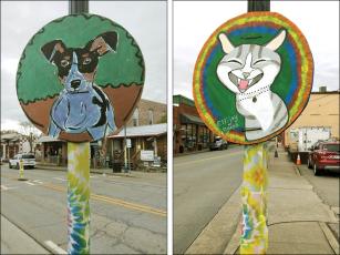 The animal-themed signs and tie-dye hanging from lampposts in downtown Ellijay signal the upcoming Woofstock festivities presented by Friends of the Gilmer Animal Shelter. 