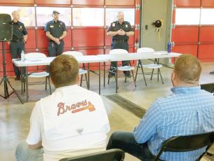 At an open house last Tuesday, attendees listen to Fire Chief Daniel Kauffman, EMS Chief Terence Evans and Deputy Fire Chief Mark Chastain discuss Gilmer Fire and Rescue’s next new recruit training academy, which will start in June. 