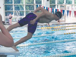 Gilmer’s Jacob Kucera dives into the pool at the Georgia Games in Canton.