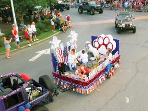 Ellijay’s Fourth of July parade winds its way through the downtown roundabout last year. This year’s parade will start at 10:30 a.m. (Photo by Robert Ferguson)