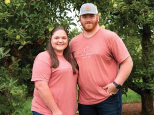 Rachel Walters is pictured with husband Jacob, and she is Gilmer High School’s new tennis head coach.