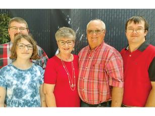 Celebrating Gwen McArthur’s 50th year with Ellijay Telephone Company (ETC) at a recent reception were family members, from left, Ransom, J.J., Gwen, husband Lloyd and Travis. 