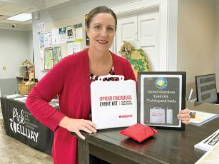 Gilmer Chamber CEO Jennifer Grimmer is shown with one of the opioid overdose event kits the North Georgia Health District has donated to businesses and facilities in its six-county region. 