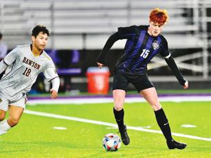 Camden Lyles controls the ball in the midfield during his senior year at Gilmer High. He will suit up next season for the Milligan University Buffaloes. (Photo Courtesy of Bingham Freelance Photography)