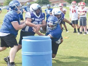 Offensive and defensive linemen compete in a game of “trashketball” at Clear Creek Middle School last Wednesday.