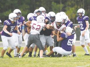Jamie Bautista (63) and the eighth-grade Bobcats make a gang tackle, and they wrapped up the regular season against Pickens at Tuesday’s press deadline.