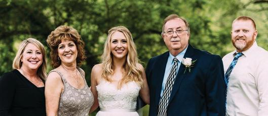 Mike Gibbs is pictured, fourth from left, with members of his family. Pictured, from left: daughter Angie Gibbs Reynolds, wife Halena, daughter Holli, Gibbs and son Matt Teague.