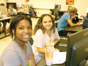 Mariah Jones, left, and Jaylene Rangel create a video in the Audio-Video Tech and Film class at the College and Career Academy. 