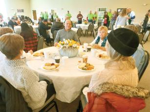 Attendees enjoyed food and fellowship at last year’s community Thanksgiving dinner hosted by Faith, Hope and Charity Recycle Store.