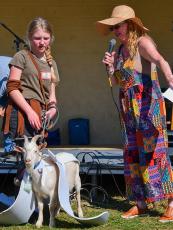 Goat owner Destiny Benson, left, is pictured with her first place-winning pet “G.O.A.T” and pageant host Ava Rogers, right. 