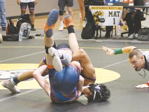 Gilmer senior Eliceo Perez pins an opponent and did the same when GHS defeated No. 1 ranked Ringgold last Saturday.
