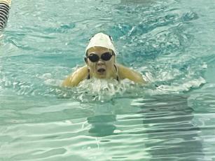 Gilmer’s Yana Jones swims the breaststroke during the Lady Cats’ 200-yard medley relay.