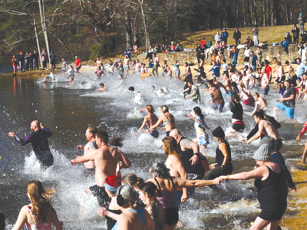 Fort Mountain State Park hosted the annual Black Bear Plunge on New Year’s Day, with 159 registered for the brief dip into the lake. Air temperature was 33 degrees with a 15-20 mph wind, according to a park spokesperson. Around 400 people attended overall. (Photo by Benny Huggins of Chatsworth)