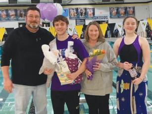 Gilmer High senior swimmer Jacob Kucera was recognized at last Tuesday’s senior night meet in Calhoun. He is joined by parents Keith and Pam and sister Elizabeth Kucera.