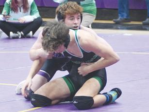Gilmer senior Bregan Berry wrestles in the semifinals of last Saturday’s Area 7-3A traditional tournament. He finished first in the 132-pound weight class and is one of 12 Bobcats who qualified for sectionals. 