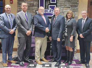 From left are, new vice chairman Jacob Callihan and chairman Michael Parks, superintendent Dr. Brian Ridley and fellow board members Doug Pritchett, Michele Penland and Joe Pflueger. 