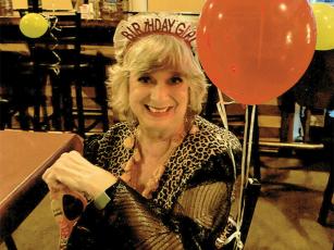 Mary Encinias, who’s coped with brittle bone disease since childhood, is shown celebrating her 70th birthday. 