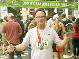 Ellijay runner Al Fuller is shown after completing the Enmarket Savannah Bridge Run. Fuller finished first in the challenging 5K’s 75-79 age group.