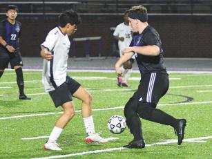 Above and below in black are, Gilmer’s Noah Turner and Calli Wise, respectively, who won possession from their Cherokee opponent last Thursday.